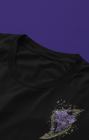 Black t-shirt, featuring a detailed purple and gold pattern, with a lightning bolt pattern on the chest with a Stranger Things inspired character popping out 
