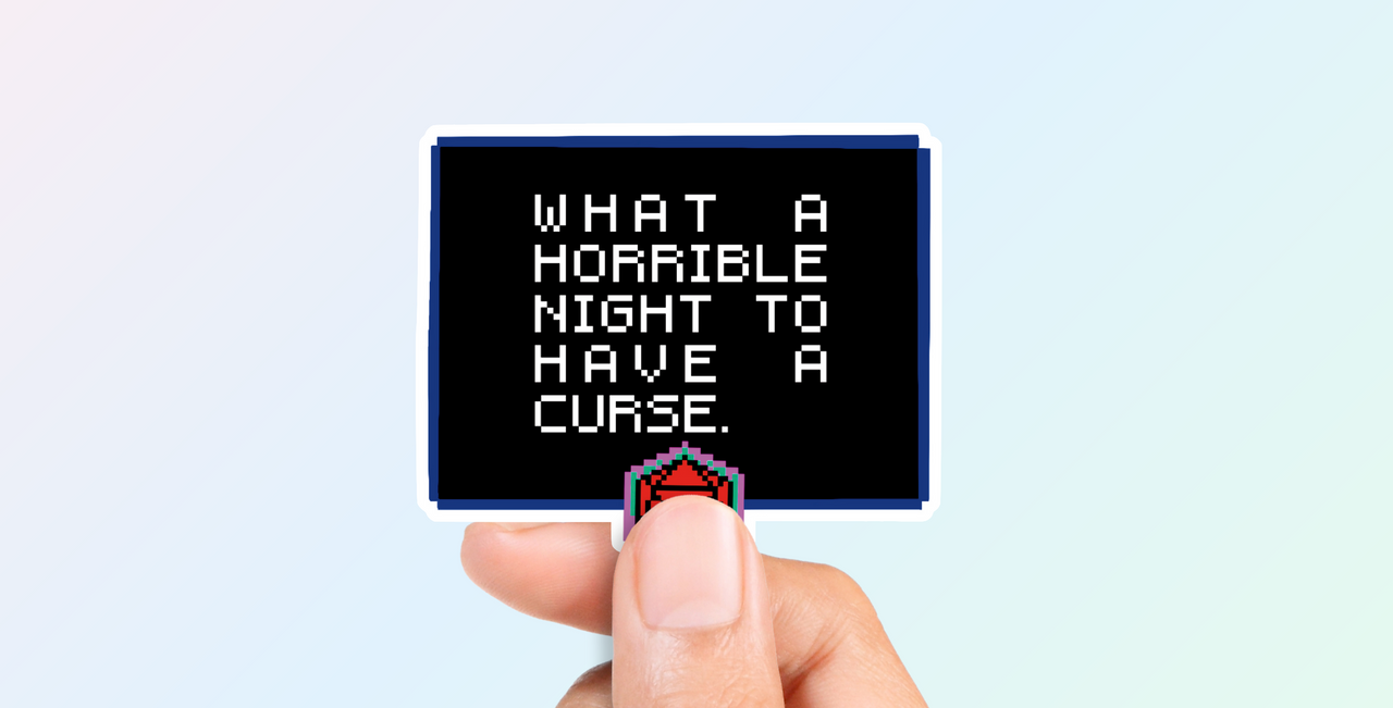  'What a horrible night to have a curse' sticker held by a hand against a light blue background